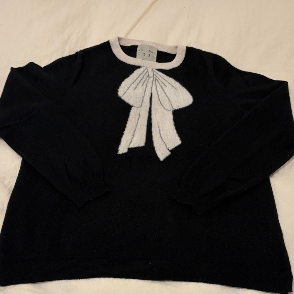 Chic Black Sweater with White Bow Accent